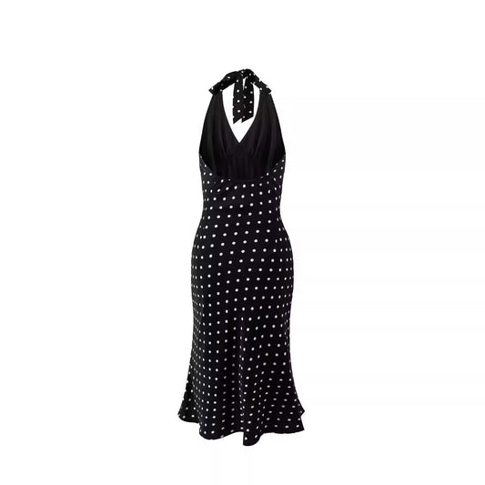 Black dress with white polka dots on a white background